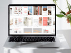 Laptop displaying a magazine layout on a white surface with a plant
