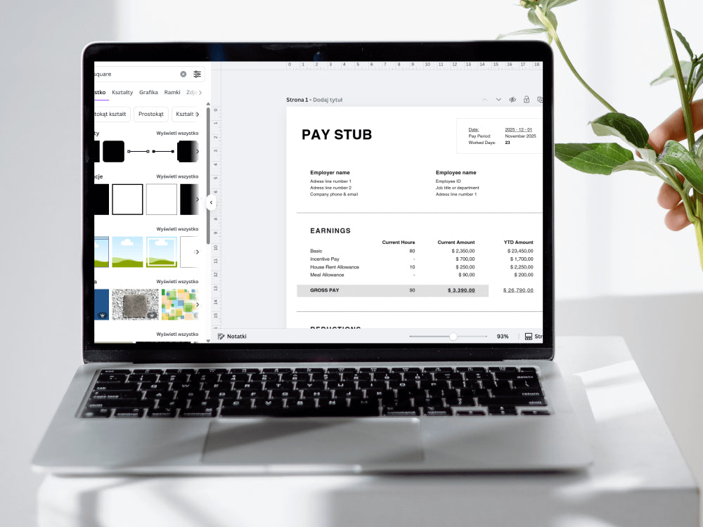 Laptop displaying a pay stub on a white surface with a plant in the background
