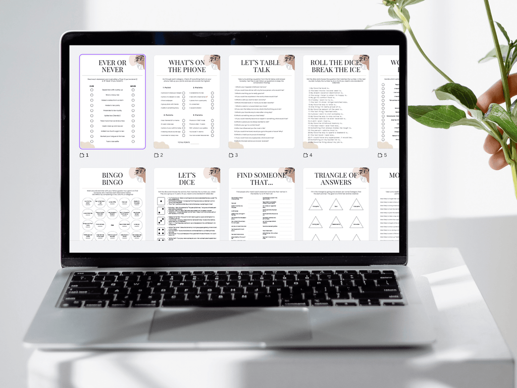 Laptop displaying a document with various activities on a white surface with a plant.