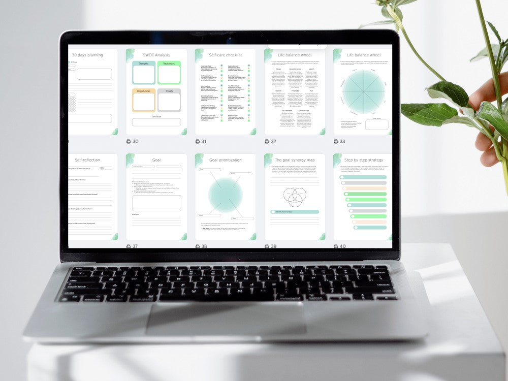 Laptop displaying a digital document on a white surface with a plant in the background