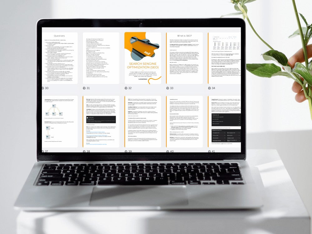 Laptop displaying a document on a white surface with a plant in the background