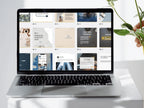 Laptop displaying a webpage with multiple articles on a white desk.
