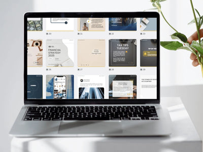 Laptop displaying a webpage with multiple articles on a white desk.