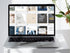 Laptop displaying a webpage with multiple articles on a white desk.