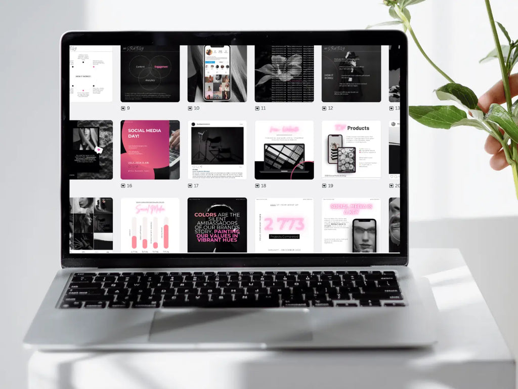 A selection of pink and black social media graphic grids opened inside a laptop screen dashboard display.