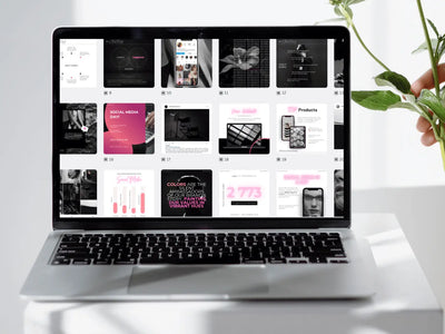 A selection of pink and black social media graphic grids opened inside a laptop screen dashboard display.