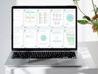 Laptop displaying a digital document on a white surface with a plant in the background