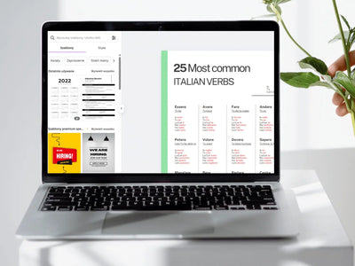 Laptop displaying a webpage with Italian verbs on a white surface with a plant.