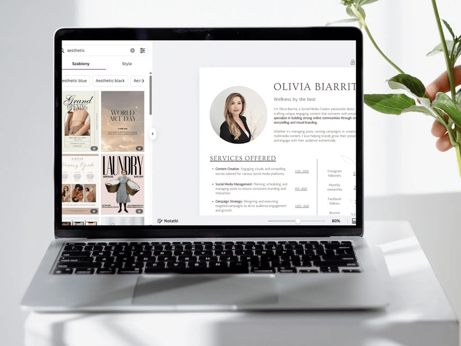 Laptop displaying a website with a profile and services offered on a white surface.