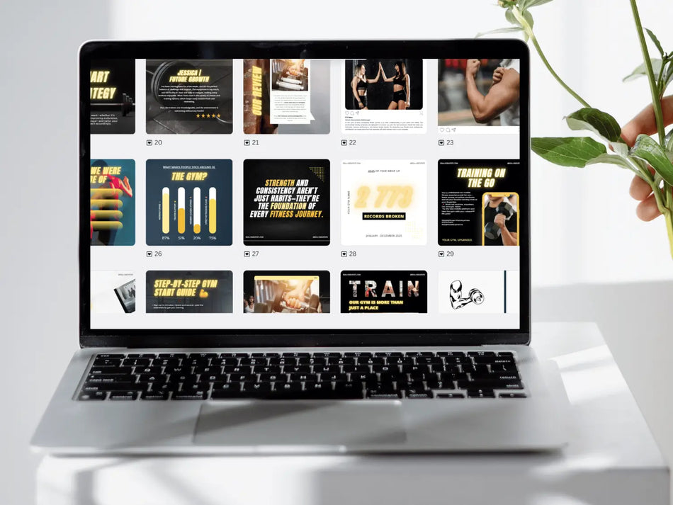 Laptop displaying a fitness-themed website on a white surface with a plant.