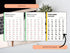 Three open books displaying Italian verb lists on a desk with a keyboard and plant.