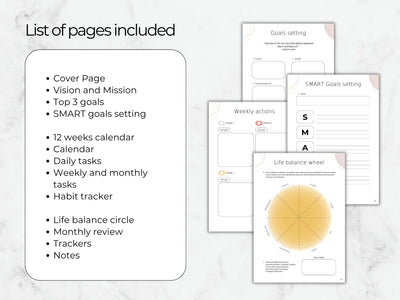 Collection of goal-setting and planning sheets on a marble surface