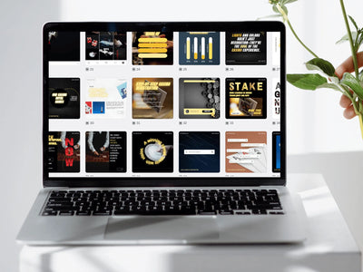 Laptop displaying a grid of various design templates on a white surface with a plant.