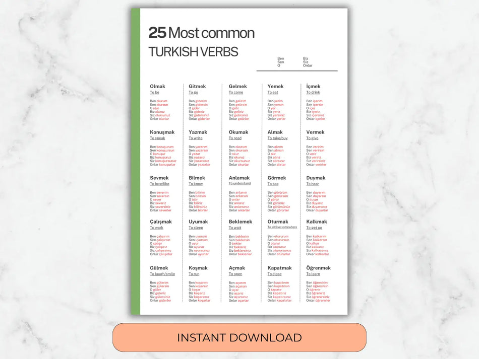 Sheet of paper with Turkish verbs on a marble background