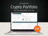 Laptop displaying a crypto portfolio on a dark background with 'Shop Now!' button.