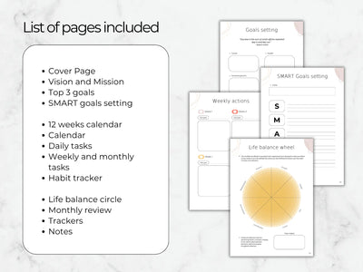 Collection of goal-setting and planning sheets on a marble surface